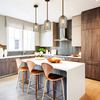 Modern Brass Pendant Light over Kitchen Island with Two Glass Shades